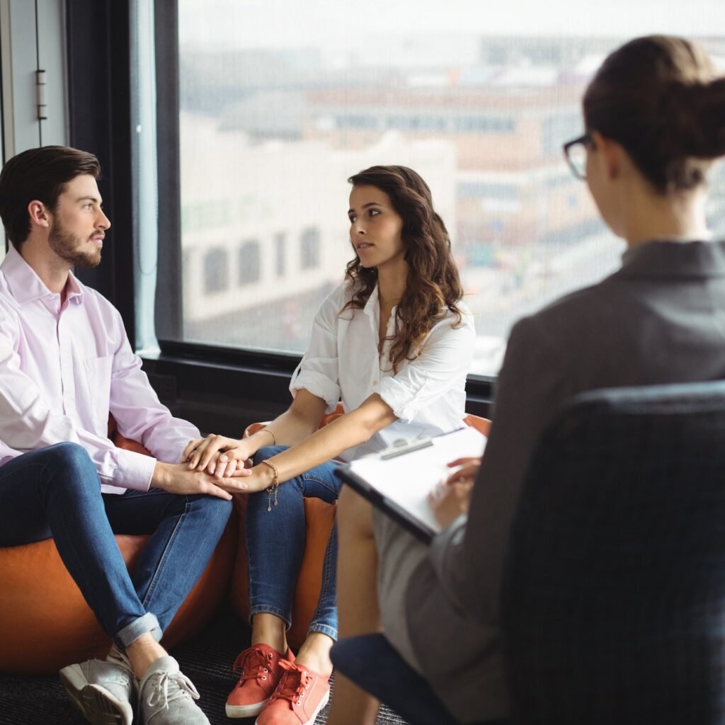 Couple talking to a marriage counselor